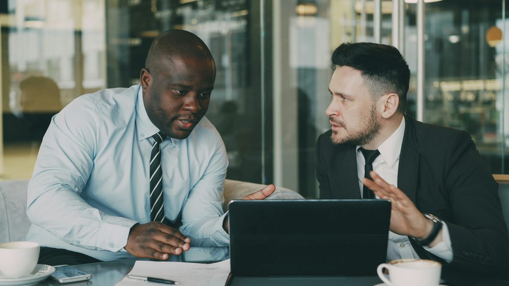 Manager having an honest one-on-one conversation with an employee, a key employee retention strategy for building trust